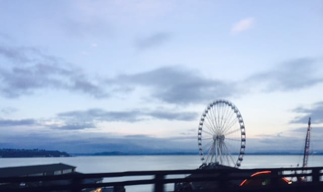 Sunset on the seattle waterfront at elliot bay, with the great ferris wheel pictured here. Taken by Power Pup carpet cleaning company