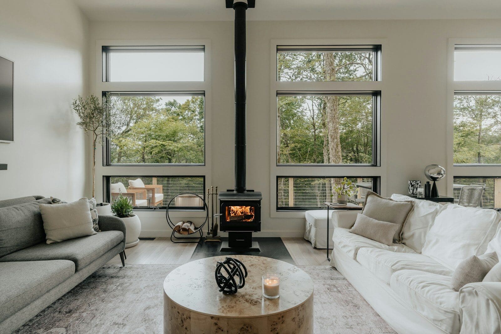A living room filled with furniture and a fire place